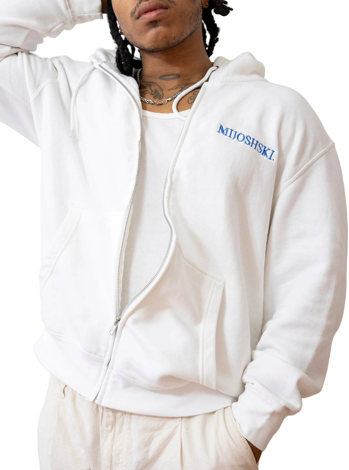 Person wearing a white hoodie with 'Mijoshski' branding on a plain background