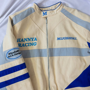 Beige racing jacket with blue and gray accents on a white background