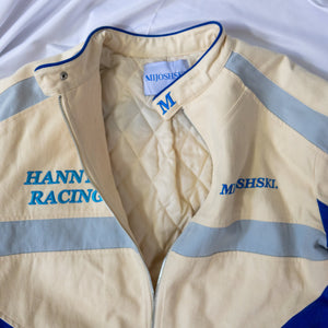 Beige racing jacket with blue and gray accents, featuring 'Hannya Racing' and 'Mijoshski' branding.